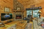 Cozy living room with wood burning fireplace